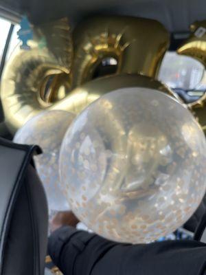 Car full of balloons for anniversary celebration time!