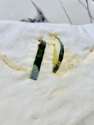 Sliced Cucumber with stickers still found in my food