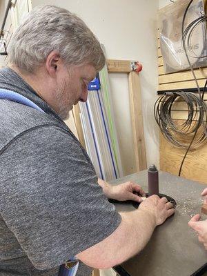 Jeff using the tool to make the chopsticks holder