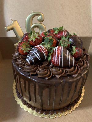 3-layered double chocolate cake with strawberry filling and chocolate covered strawberries