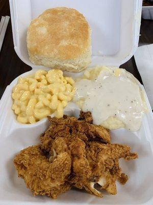 Chicken tenders, mac and cheese, mashed potatoes and gravy, huge biscuit