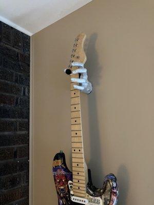 Wall-mounted hand guitar hanger $20