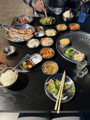 Marinated kbbq ribs, marinated cubed filet mignon, banchan salad, soju