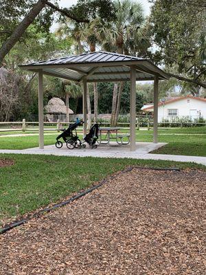 New pavilion with picnic tables.