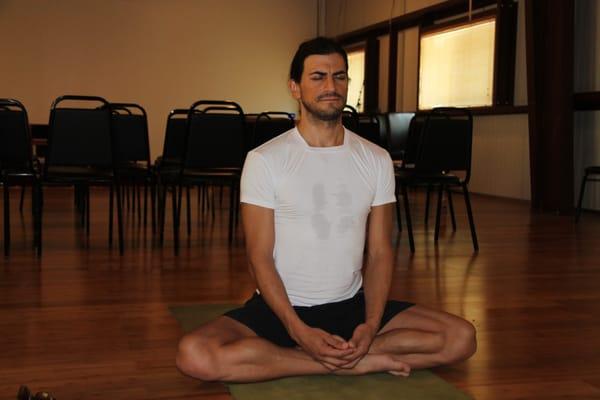 Marcos Jassan, famous Mexican yoga teacher, teaching yoga at the Synchronicity sanctuary during a mediation retreat.