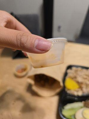 the small container of chili oil that costs 50 cents to bring home