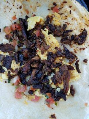 This is my steak and eggs burrito.  Steak is dried and burnt. Yeah, paid more than $5 for this garbage.