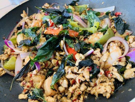 Ground chicken, minced shrimp, and freshly fried crispy basil on top.