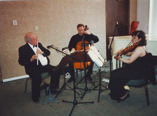 Trio performing for anniversary party.