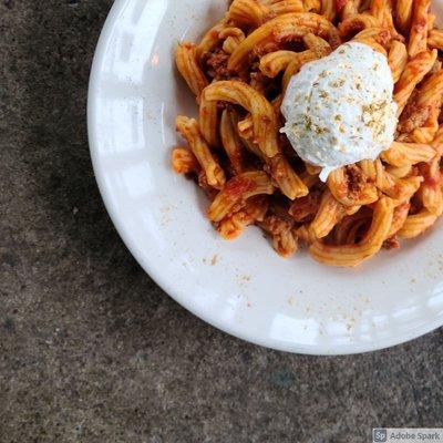 Sausage Ragu Pasta: House-made garganelli pasta, sausage ragu, pecorino crema, & fennel dust.