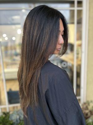 Sunkissed brunette. Brunette with caramel highlights. Easy grow out lightened brunette. Lightened with color not bleach.