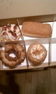 My half dozen, bacon maple, old fashioned rasberry jelly and carrot cake.. i ate the other 2