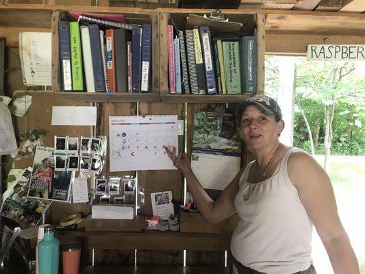 Annie, the owner, explaining the Farmer's Almanac Calendar.