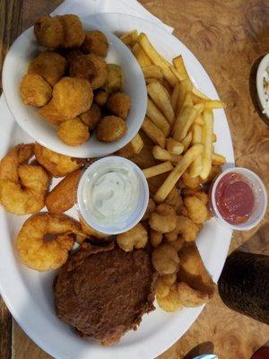 Seafood Platter Crab cake, Flouder, Gulf and Popcorn Shrimp  Fried Okra!!hushpuppies & fries!I substituted popcorn shrimp for scallops ..