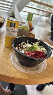 Beet and quinoa salad paired with their pork in a light green salsa.