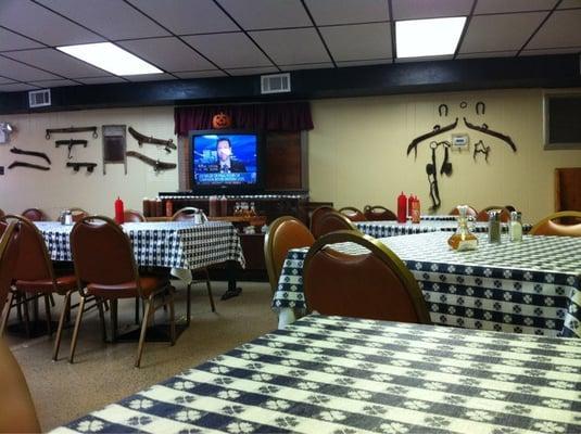 Inside the main dining room. Dig the farm tool decor.