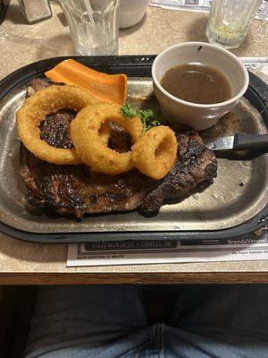 T-bone steak sauce carrot slice and onion rings