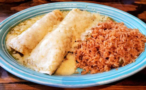 Gonzalez Special: Beef Burrito, Chicken Enchilada, Mexican Rice, topped with Queso and Salsa Verde. Muy Delicioso!