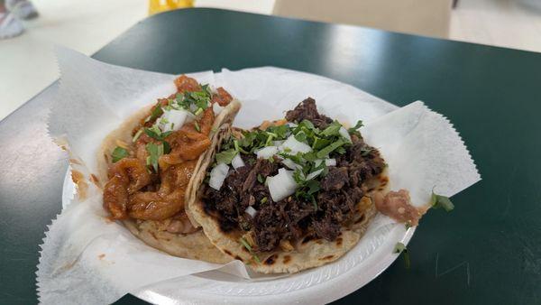 Barbacoa and chichiron both loaded with refried beans and rice.