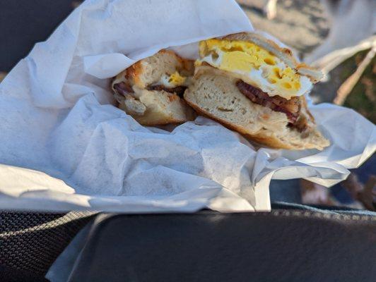 Bacon and egg and cheese on a bacon and cheese bagel