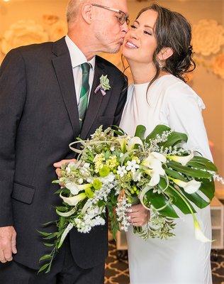 For the Modern Bride a stunning bouquet of fresh greens and whites of calla lilies, fragrant stock, sweet stephanotis, and tulansia.