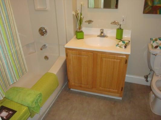 Clean & Modern Bathrooms with Tub and Tiled Floors