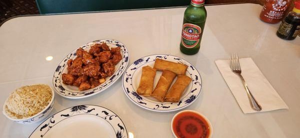 Orange Chicken, fried rice, eggrolls and Chinese beer.