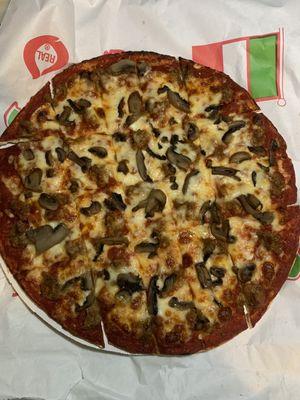 Large thin crust sausage and mushroom pizza