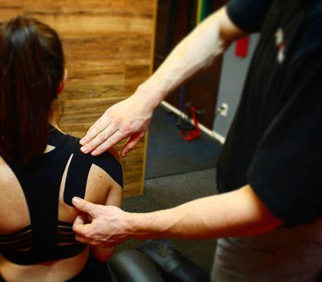 Kinesiotaping for a patient with shoulder pain. Sitting, overhead activities, and even texting can cause irritation. Let's fix that.