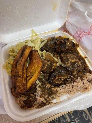 Oxtail plate, rice and peas, Fried Plantain, and cabbage