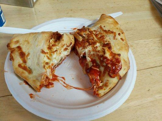 3 meat calzone. Sauce is in the calzone. Perfect dough. Excellent pepperoni with zing.