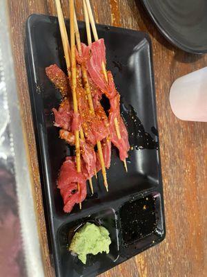 Raw beef skewers