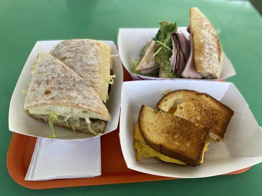 Top left- stiffler's mom= grilled chicken on ciabatta Top right- ham and avocado  Bottom right- the works = sausage and egg on