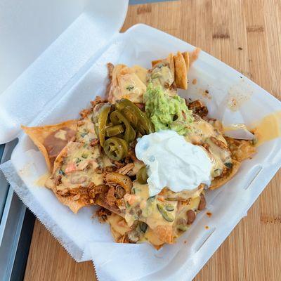 #5 Cheps Nachos with Beef or Chicken Fajitas topped with our homemade Chile Con Queso, Guacamole, Sour Cream, and Jalapeños