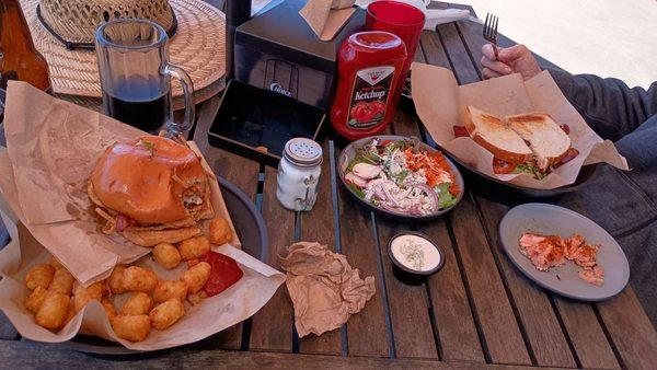 Burger, tots, side salad, half eaten side salmon off of the "salmon BLT".