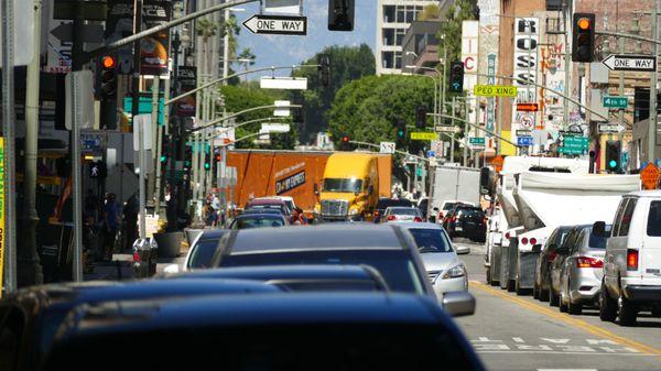 Our driver maneuvering through heavy downtown traffic with this huge moving company tractor trailer. impressive.