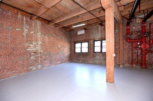 Brick Walls & original wood beams, this building has charm and a great vibe!