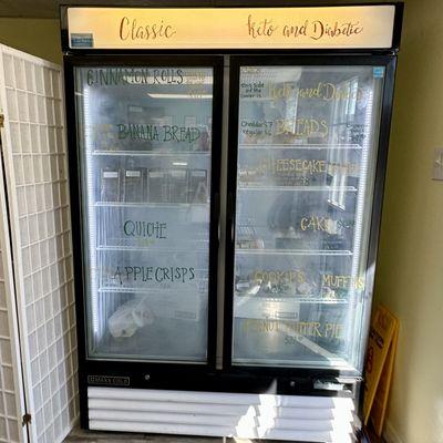 Refrigerator of cinnamon rolls, breads, apple crisp, muffins, etc.