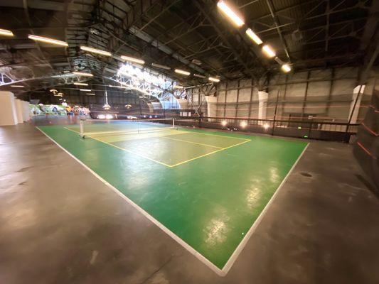 Upper level court. 1 of 2 courts. All court surfaces are made of plastic tiles.