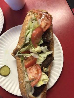 Hamburger sub with lettuce fresh tomatoes  and mayonnaise