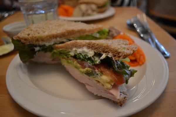 roasted turkey sandwich with havarti cheese and guac.