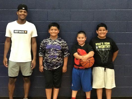 Coach Jay and three trainees ready for Basketball training at Diamond Hill Community Center