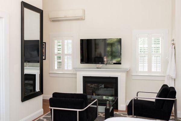 Sitting area and fireplace in Luxury King Room #7 in the carriage house.