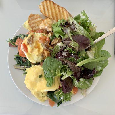 salmon and spinach eggs benedict! with salad, bread, diced potatoes (hiding underneath salad) AHMAZINg deal and Yum