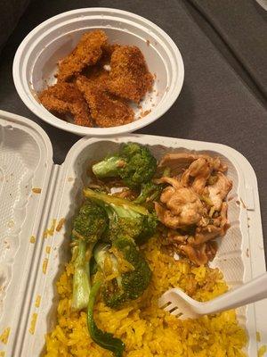 Fried shrimp & chicken & broccoli with fried rice.