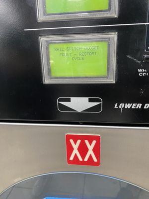 A dryer at a laundromat.