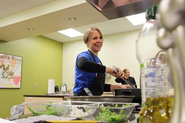 Teaching a cooking demo at the NewBo City Market for the Blue Zones.