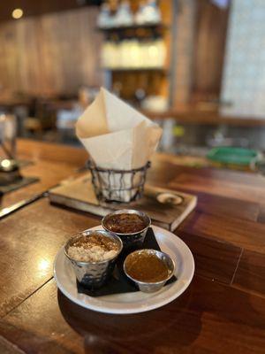 The bean dip and salsas for the chips.