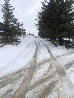 Piss poor plow job of my driveway.