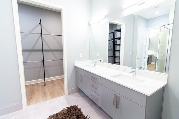 Spa-like bathroom with walk-in closets